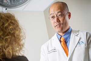 Dr. Paul Park discussing with a patient